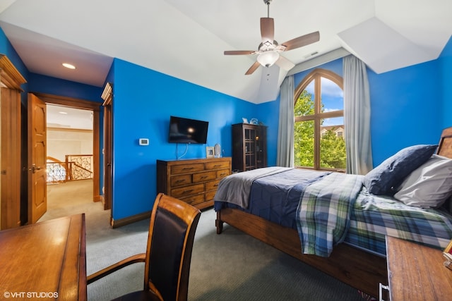 bedroom with vaulted ceiling, ceiling fan, and light colored carpet