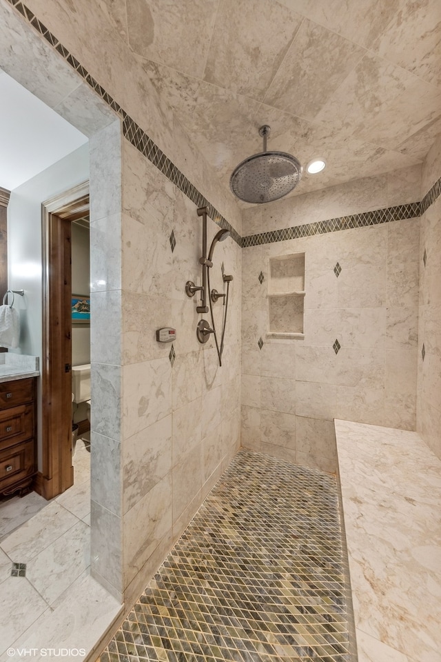 bathroom featuring tiled shower