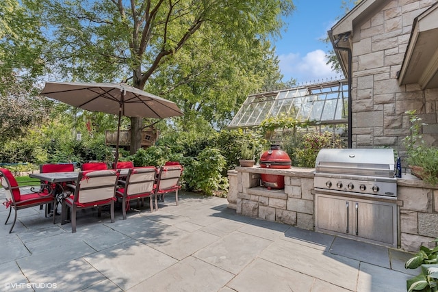 view of patio / terrace featuring area for grilling and exterior kitchen