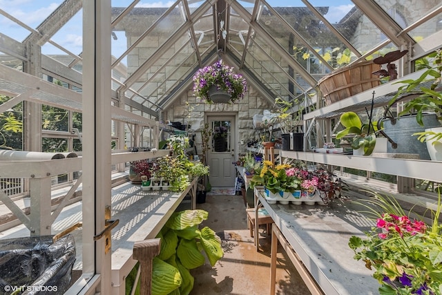 sunroom / solarium with vaulted ceiling