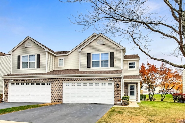 front facade featuring a front yard and a garage