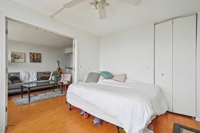 bedroom with a closet, ceiling fan, and hardwood / wood-style floors