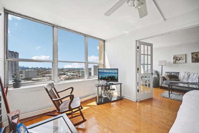 office area featuring wood-type flooring and ceiling fan