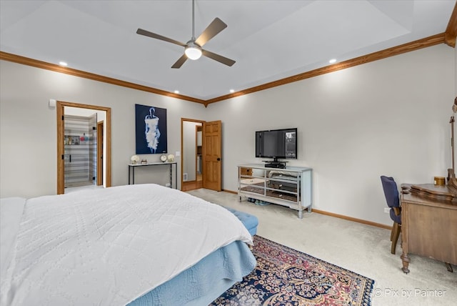 carpeted bedroom with ceiling fan, a closet, ornamental molding, and a spacious closet