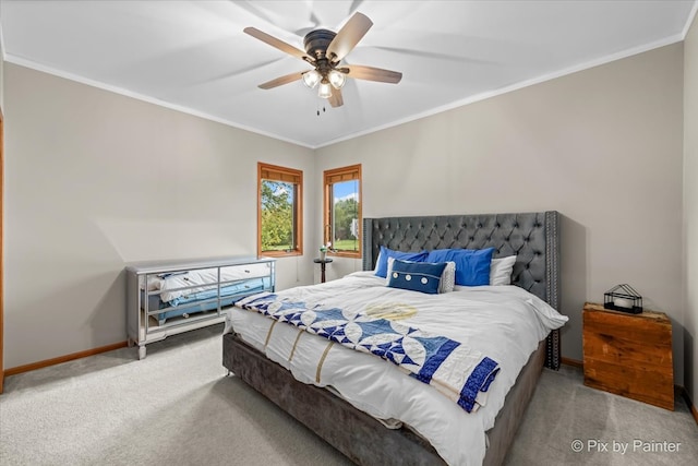 bedroom with ornamental molding, ceiling fan, and light colored carpet