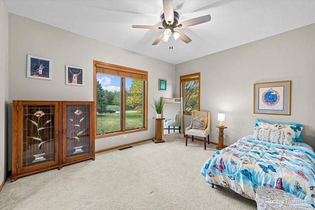 carpeted bedroom with ceiling fan