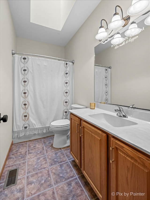 full bathroom with shower / bath combination with curtain, tile patterned flooring, vanity, and toilet