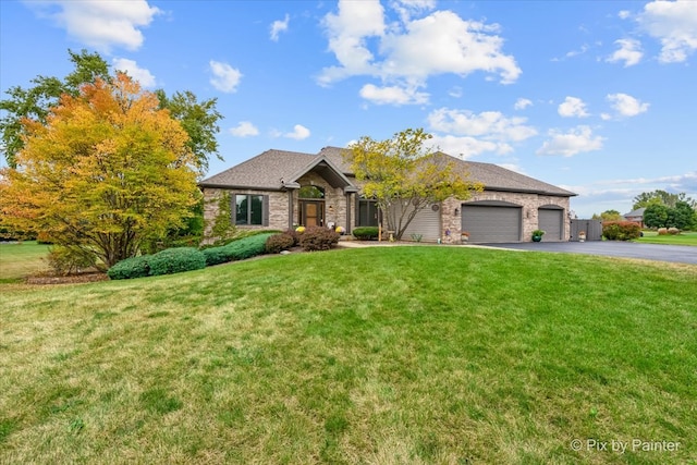 view of front of home featuring a garage and a front lawn