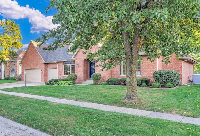 view of front of property featuring a garage and a front lawn