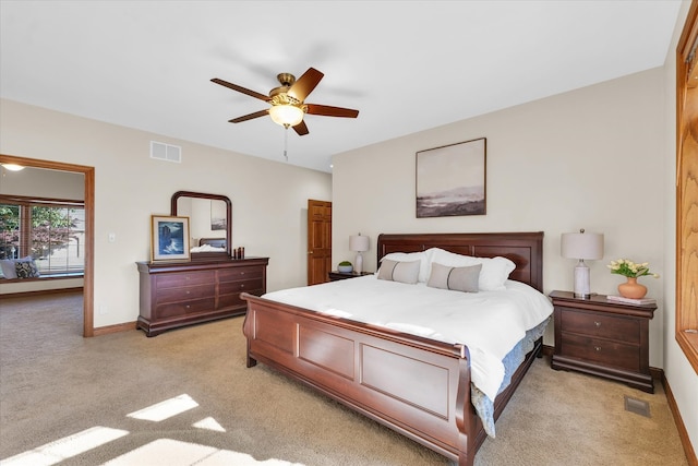 bedroom featuring light colored carpet and ceiling fan