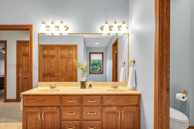 bathroom featuring vanity, toilet, and tile patterned floors