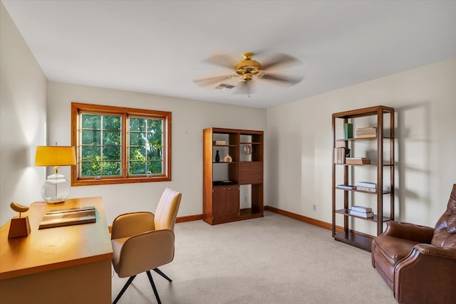 carpeted home office with ceiling fan