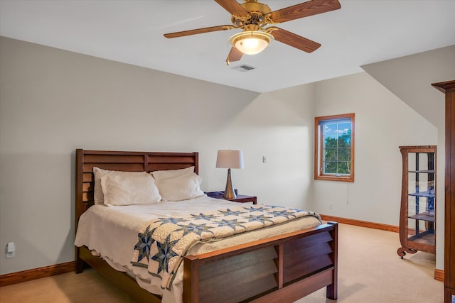 bedroom with light carpet and ceiling fan