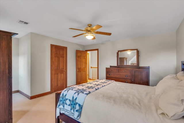 bedroom featuring light carpet and ceiling fan