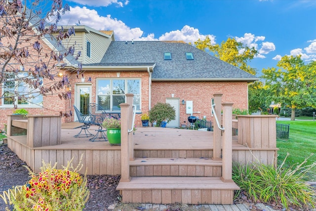 back of property with a wooden deck