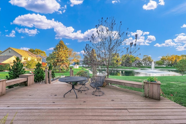 wooden terrace with a water view