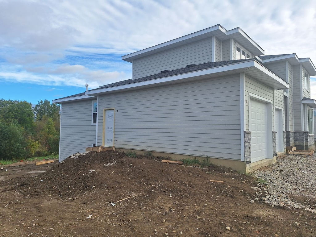 view of home's exterior with a garage