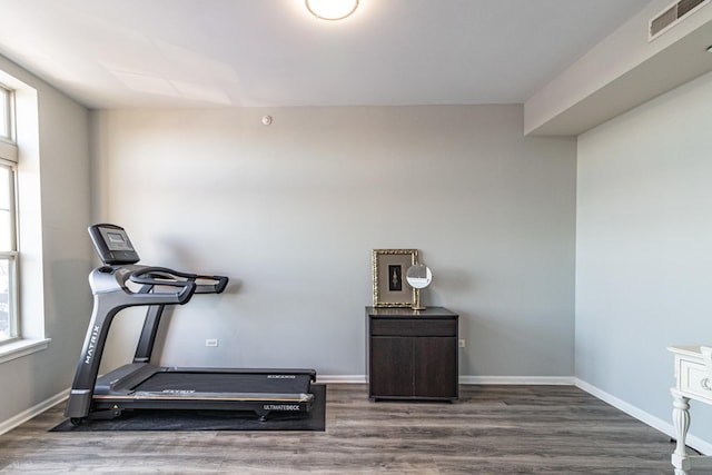 workout area with dark hardwood / wood-style flooring