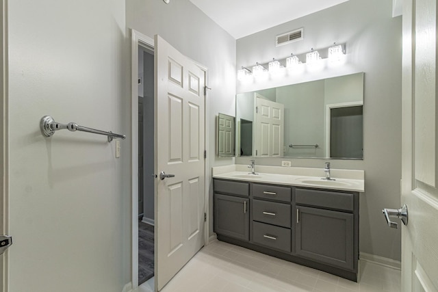 bathroom featuring tile patterned floors and vanity