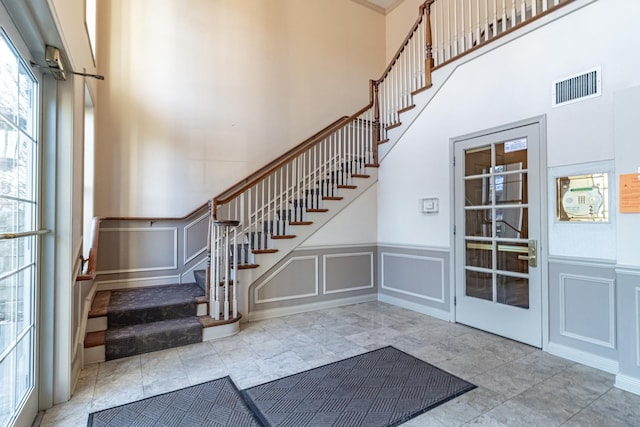 interior space featuring a towering ceiling