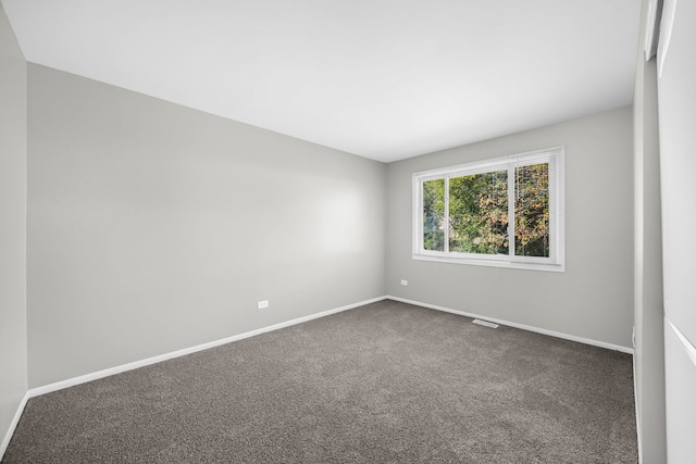 unfurnished room with carpet floors