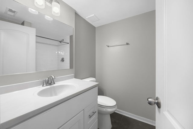 bathroom with tile patterned floors, a shower, vanity, and toilet