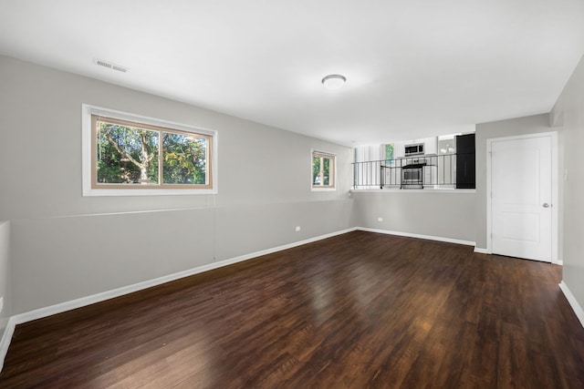 unfurnished room featuring dark hardwood / wood-style floors