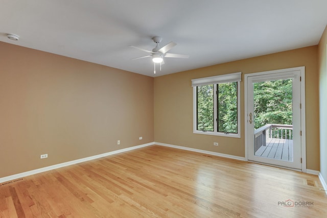 empty room with light hardwood / wood-style floors and ceiling fan