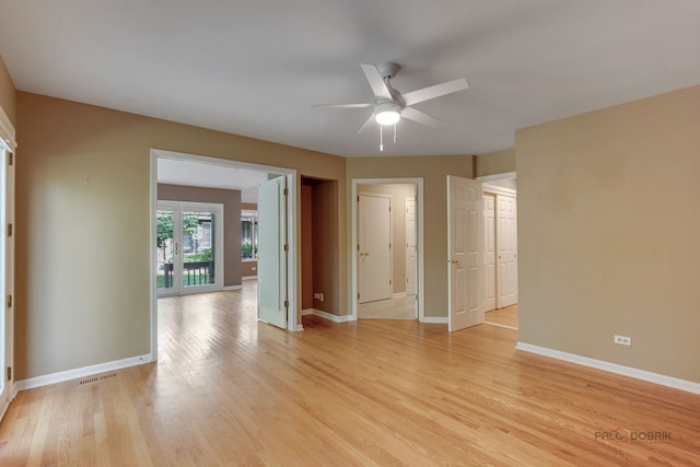 unfurnished room with ceiling fan and light hardwood / wood-style floors