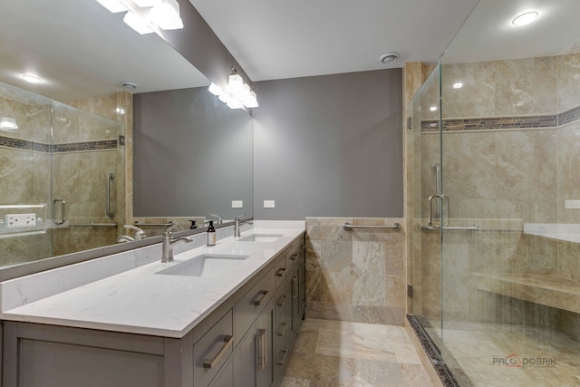 bathroom with an enclosed shower and vanity