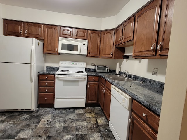 kitchen featuring sink and white appliances