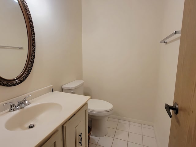 bathroom with tile patterned floors, vanity, and toilet