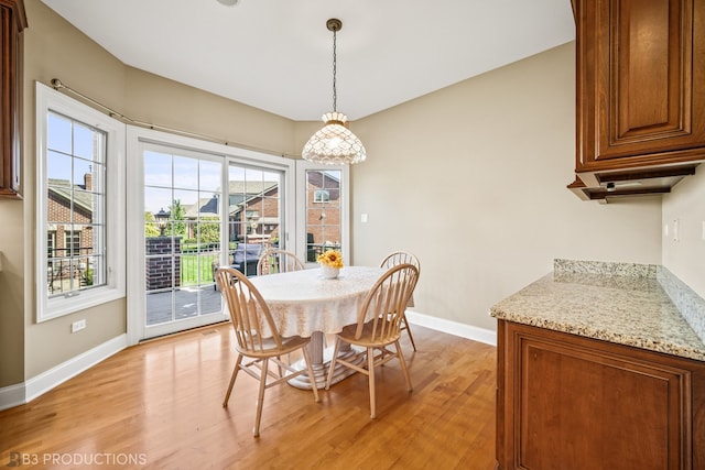 dining area with light wood-type flooring