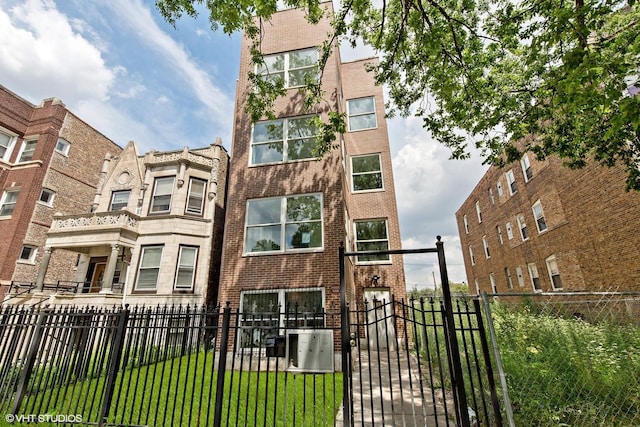 3544 W Douglas Blvd, Chicago, IL 60623 - view of apartment building / complex with a fenced front yard
