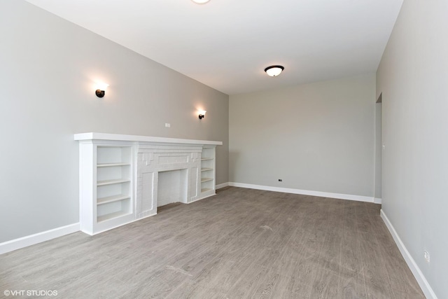 3544 W Douglas Blvd, Chicago, IL 60623 - unfurnished living room with wood finished floors and built in shelves