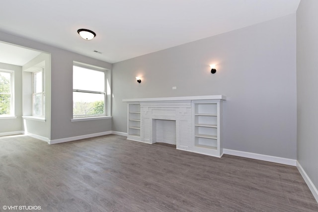 3544 W Douglas Blvd, Chicago, IL 60623 - unfurnished living room with dark wood-style floors and a fireplace