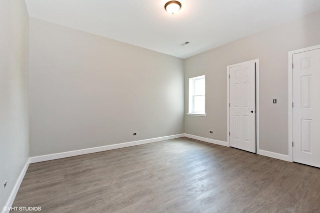 3544 W Douglas Blvd, Chicago, IL 60623 - unfurnished bedroom with wood finished floors and baseboards