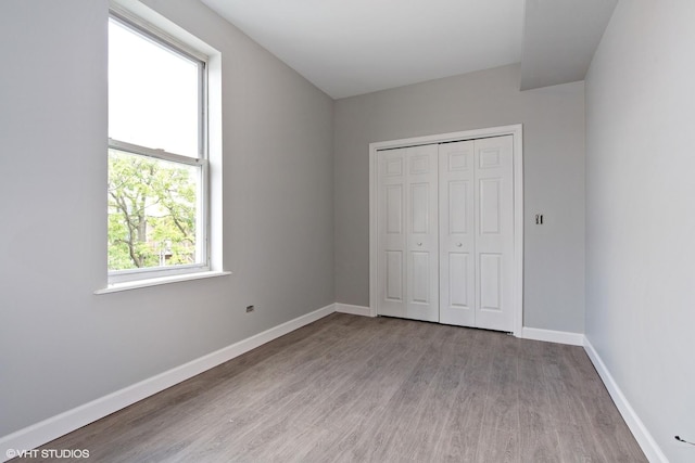 3544 W Douglas Blvd, Chicago, IL 60623 - unfurnished bedroom with wood finished floors and a closet