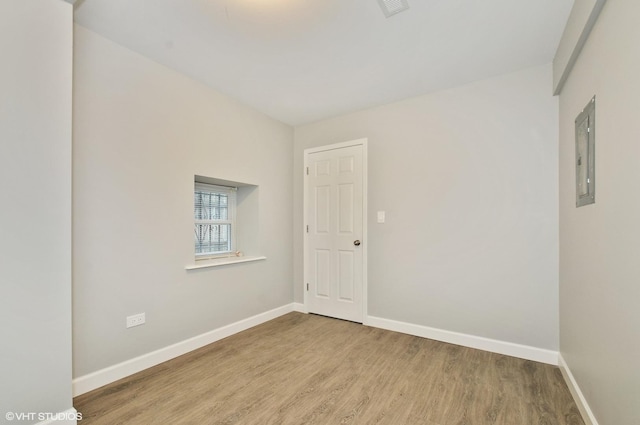3544 W Douglas Blvd, Chicago, IL 60623 - unfurnished room featuring wood finished floors and electric panel