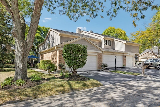 front of property with a garage