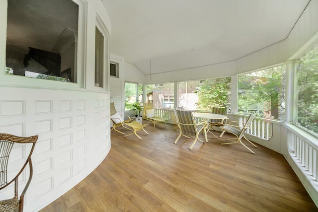 sunroom / solarium with vaulted ceiling