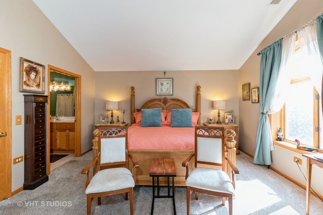 bedroom featuring lofted ceiling, beverage cooler, ensuite bath, and carpet floors