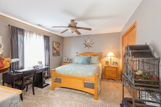 bedroom featuring ceiling fan and light colored carpet