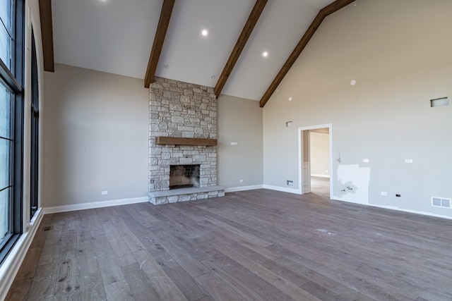 4463 Kettering Dr, Long Grove, IL 60047 - unfurnished living room with high vaulted ceiling, beamed ceiling, wood finished floors, and a stone fireplace