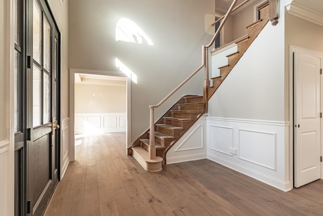 4463 Kettering Dr, Long Grove, IL 60047 - staircase featuring a decorative wall, wood finished floors, a wainscoted wall, and ornamental molding