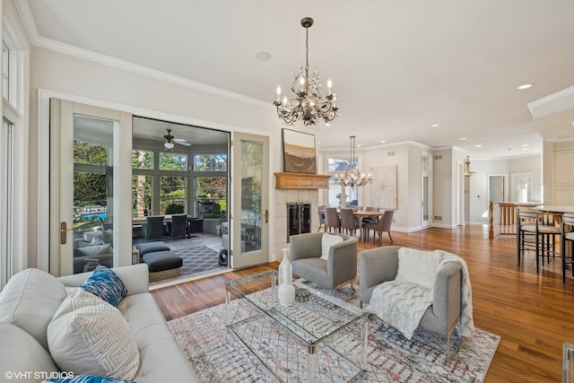 living room featuring hardwood / wood-style flooring and ornamental molding