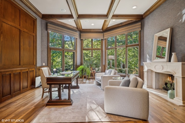 sunroom / solarium featuring beam ceiling, a high end fireplace, and coffered ceiling