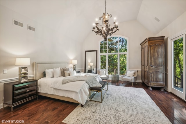 bedroom with dark wood-type flooring, high vaulted ceiling, access to outside, and a chandelier