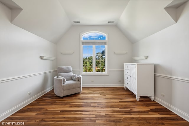 sitting room with lofted ceiling and dark hardwood / wood-style floors