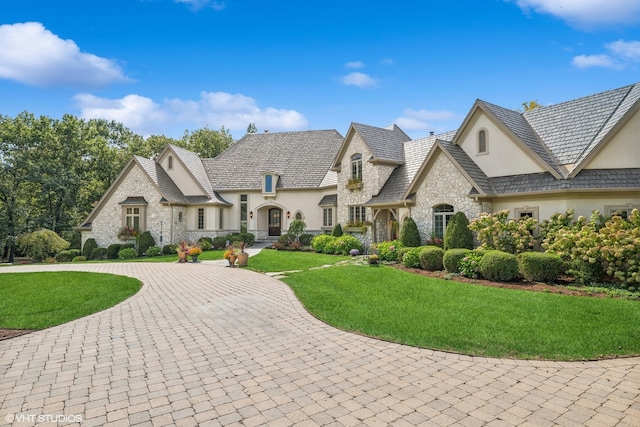 french country home with a front yard